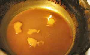 Artichoke-orange juices boiling down to a glaze