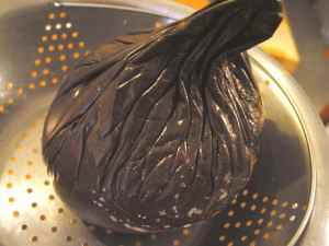 The eggplant pulp starts to move down