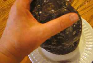 Grab the eggplant like a pastry bag, cut end down