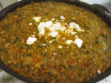 Adding a bit of feta to cowpea curry