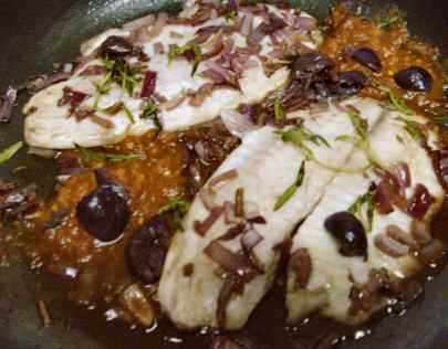 tilapia fillets Veracruz-style, with smoky salsa, onions, garlic, alfonso olives, red wine and fresh za'atar or "wild thyme"