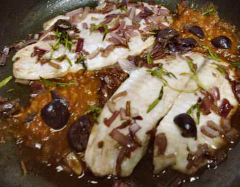 tilapia fillets Veracruz-style, with smoky salsa, onions, garlic, alfonso olives, red wine and fresh za'atar or "wild thyme"