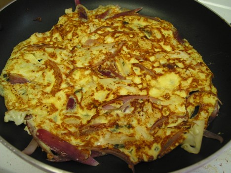 Cauliflower omelet, flipped to cook the underside