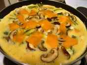 Zucchini and egg mixture in pan